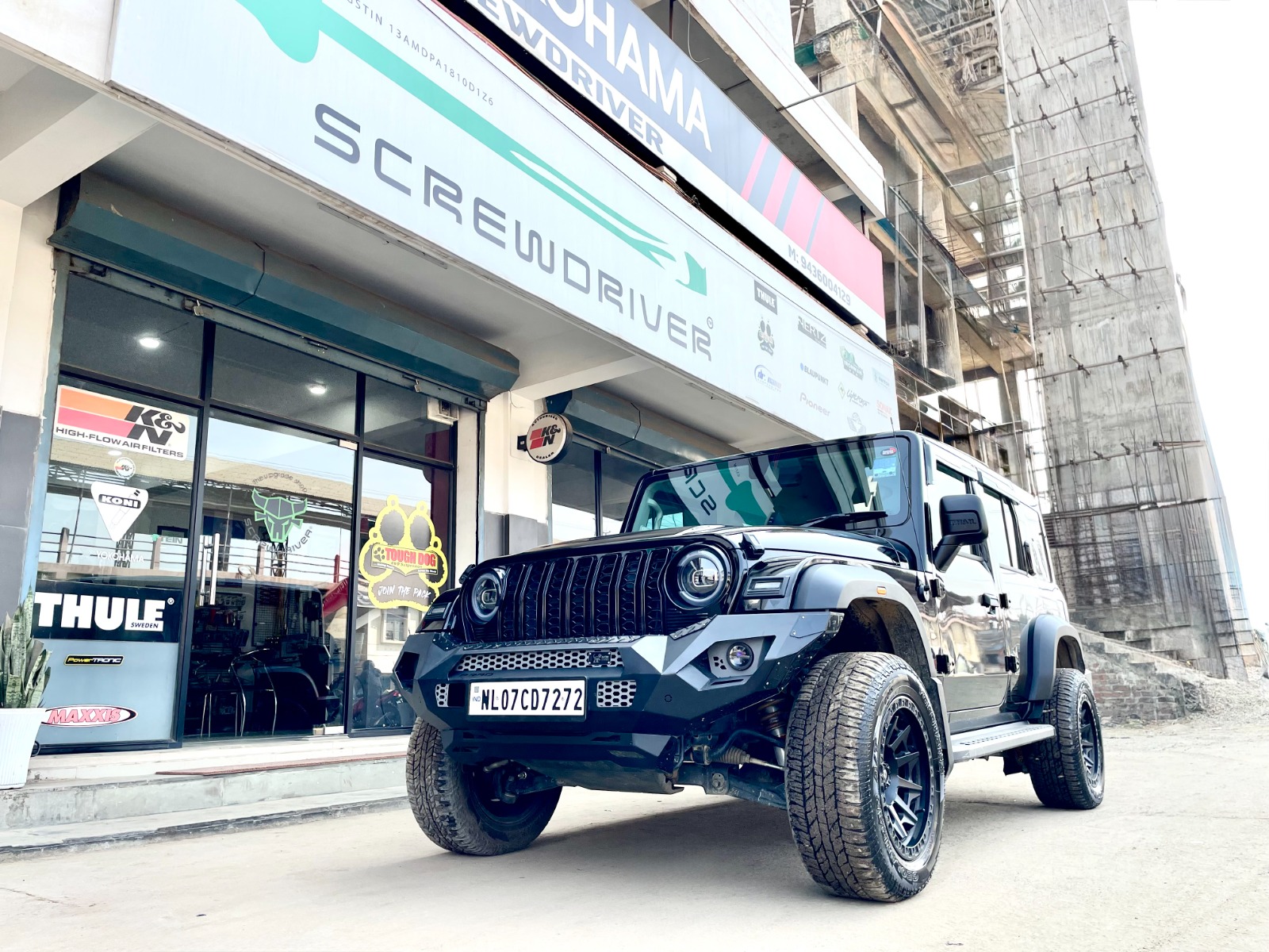 Modified Mahindra Thar parked at Screwdriver storefront in Dimapur Nagaland with brand signage